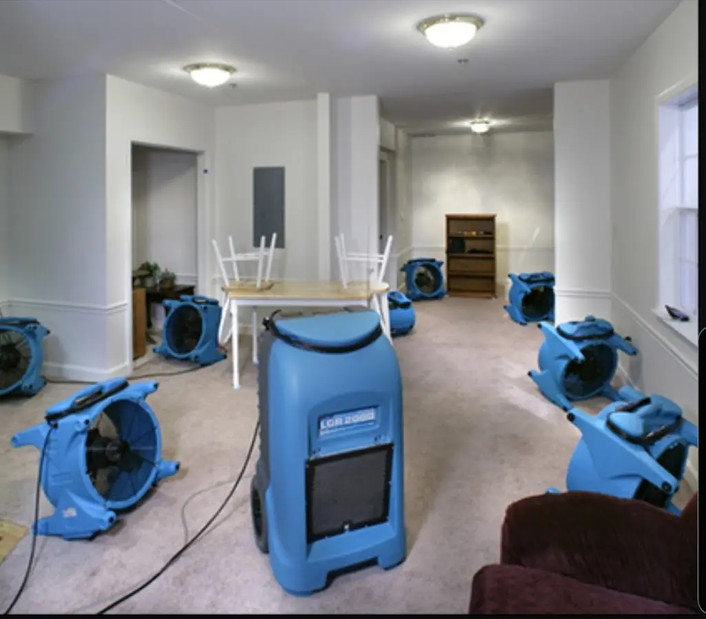 Air movers and dehumidifier setup for Water Damage Restoration in Brush